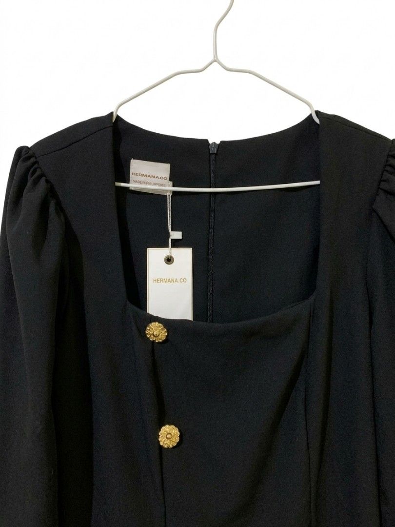 Hermana Amore (Category: Dresses) located in Quezon City. Submitted by ollieollie01 (Listing ID 1464297411, Image 3). Description: - Elegant black midi dress - Flattering square neckline - Stylish puff sleeves - Chic gold button details on front and cuffs - Tailored fit for a sophisticated silhouette - Convenient side slit for ease of movement - Ideal for formal occasions or a glamorous night out - Complete the look with heels.