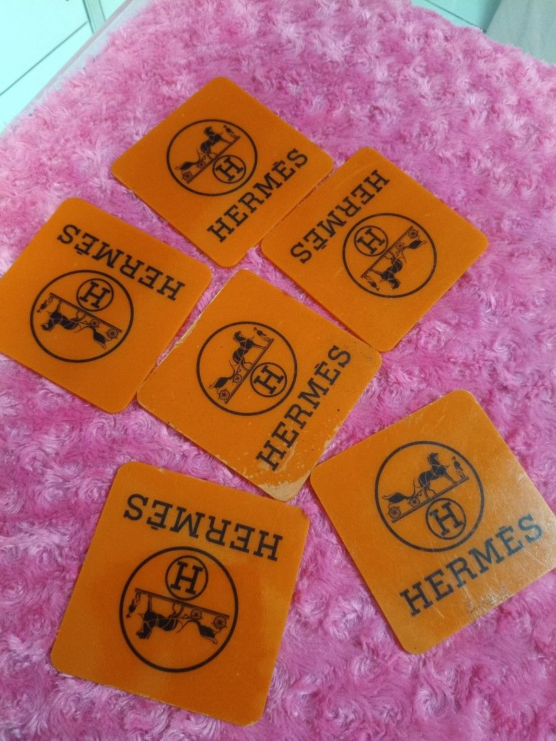 Hermes Orange Coasters Set (Category: Coffee & Tea Tableware) located in Pasay City. Submitted by ynamariie (Listing ID 1464246702, Image 1). Description: - Set of 6 Hermes coasters - Classic orange color with Hermes logo - Square shape, approx. 4x4 inches - Ideal for your home bar or as a thoughtful gift.