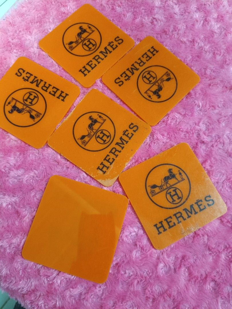 Hermes Orange Coasters Set (Category: Coffee & Tea Tableware) located in Pasay City. Submitted by ynamariie (Listing ID 1464246702, Image 2). Description: - Set of 6 Hermes coasters - Classic orange color with Hermes logo - Square shape, approx. 4x4 inches - Ideal for your home bar or as a thoughtful gift.