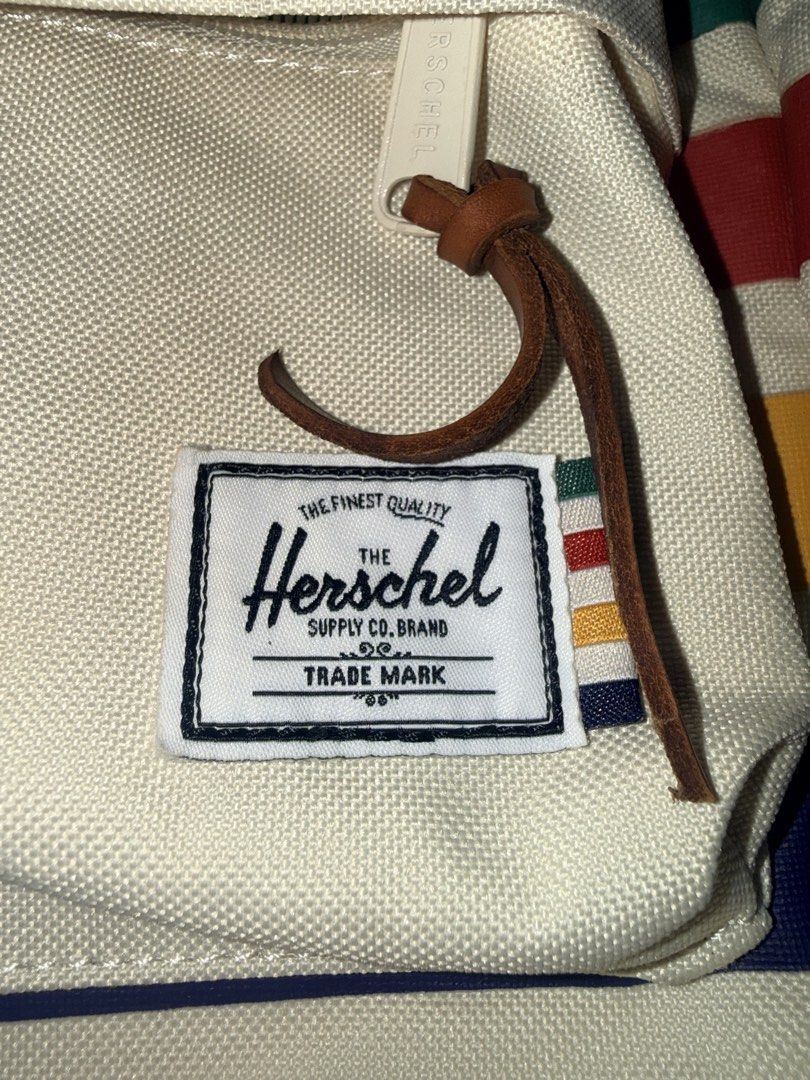 Herschel Supply Co. Backpack Cream Striped (Category: Babies & Kids Fashion) located in Tarlac. Submitted by iamjozha (Listing ID 1464184392, Image 2). Description: - Cream Herschel backpack for toddlers - Brand new. Never used - Colorful stripe detail on front pocket - Leather zipper pulls - Signature diamond logo patch - Washed once and some stains present on front and back (as pictured) - Adjustable straps for a comfortable fit - Ideal size fo