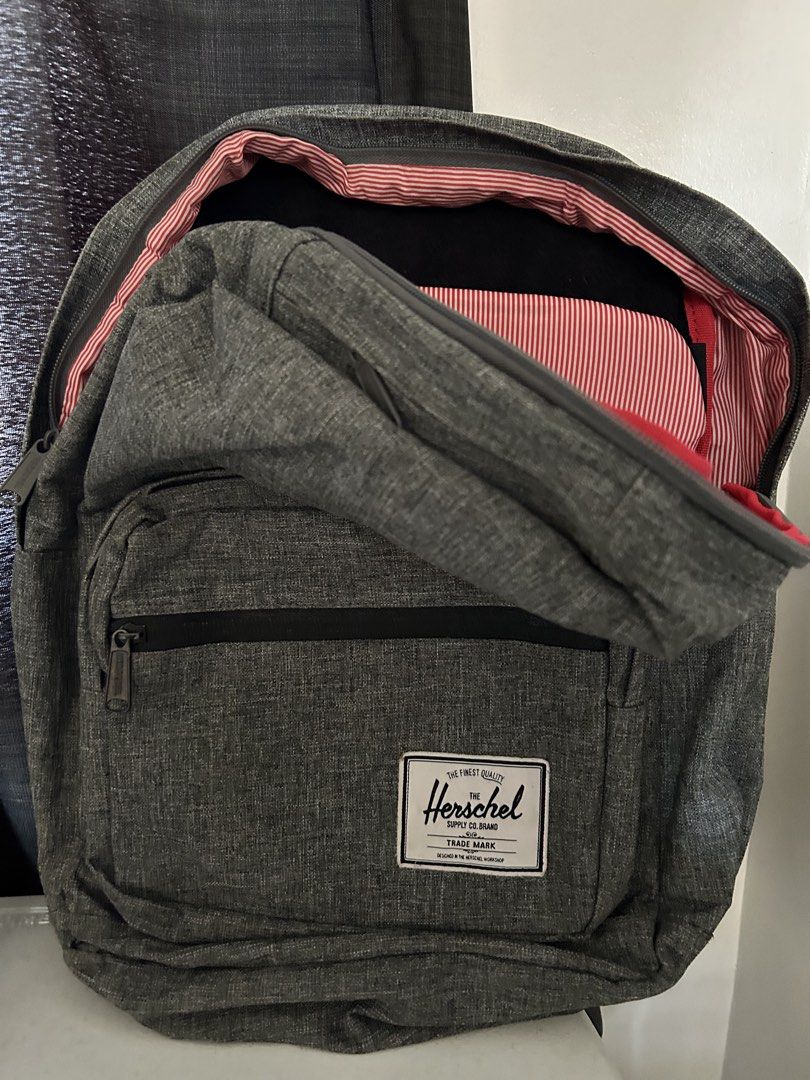 Herschel Supply Co. Backpack Grey Heather (Category: Backpacks) located in Roxas City. Submitted by preloved_by_workingstudent (Listing ID 1464204939, Image 1). Description: - Classic Herschel backpack in grey heather - Signature red and white striped lining - Main compartment with internal organizers - Front pocket with internal organizers - Top zip pocket - Ideal for school or everyday use - All zippers are smooth and intact - strictly no payme