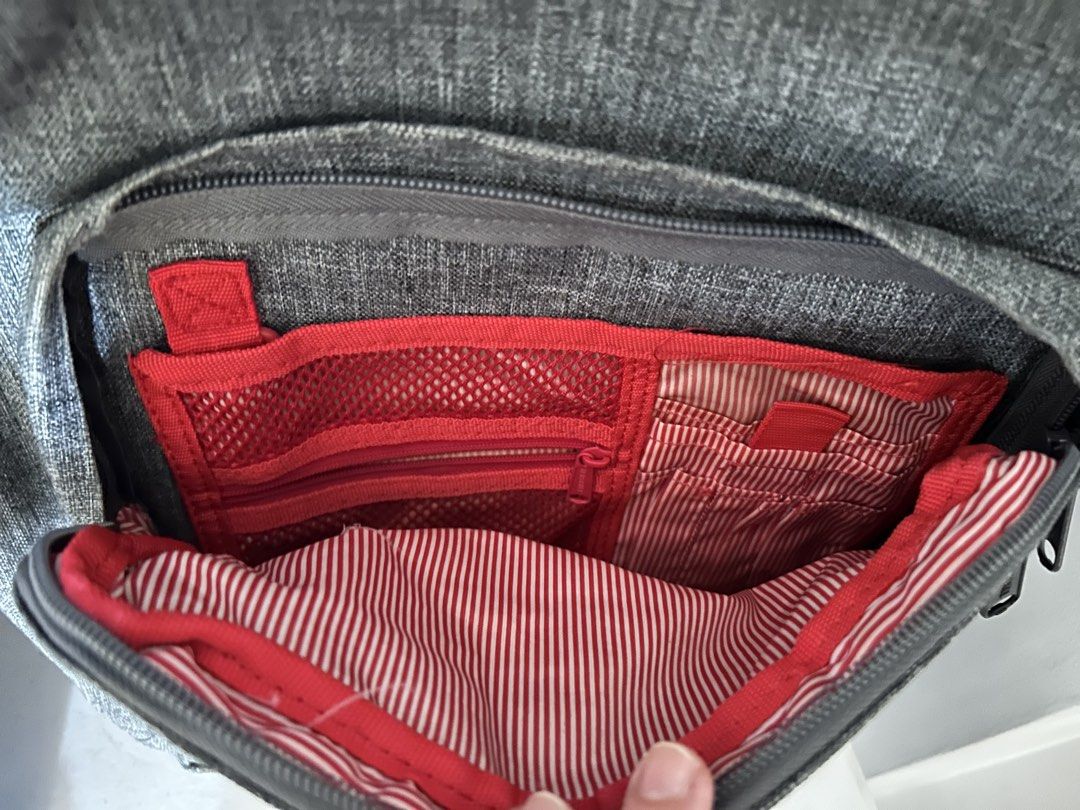 Herschel Supply Co. Backpack Grey Heather (Category: Backpacks) located in Roxas City. Submitted by preloved_by_workingstudent (Listing ID 1464204939, Image 3). Description: - Classic Herschel backpack in grey heather - Signature red and white striped lining - Main compartment with internal organizers - Front pocket with internal organizers - Top zip pocket - Ideal for school or everyday use - All zippers are smooth and intact - strictly no payme