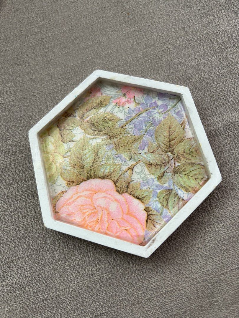 Hexagon Resin Coaster - Botanical Design (Category: Dinnerware & Cutlery) located in Quezon City. Submitted by hygge.elements (Listing ID 1464162607, Image 3). Description: 1 pc Handmade hexagon coaster - Design 1: Beautiful pink rose and floral pattern. - Design 2: Vibrant green leaf design. - Protects your furniture from drink stains - Holds your fave trinkets or jewelry - Adds a touch of unique decor to any room. - Perfect as a thoughtful gift