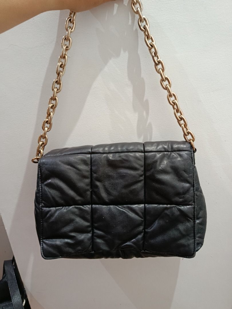 H&M Black Quilted Chain Shoulder Bag (Category: Shoulder Bags) located in Pasay City. Submitted by coolfire.dc0ea2 (Listing ID 1464184001, Image 2). Description: - Black quilted shoulder bag - Brand: H&M - Gold chain strap - Magnetic snap closure - Interior zip pocket - Spacious enough for essentials - Versatile for everyday or night out *Negotiable Location Pasay.