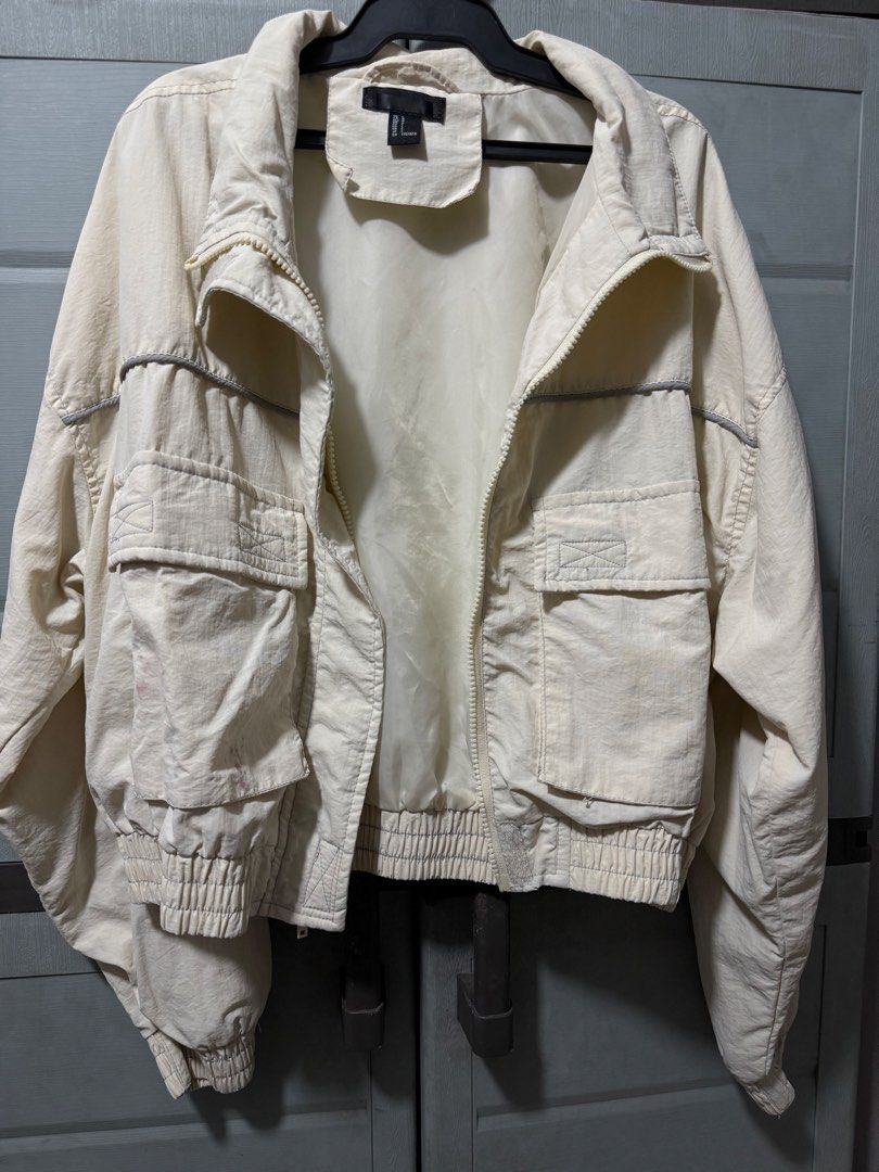 Forever 21 Cream Utility Jacket (Category: Coats, Jackets and Outerwear) located in Manila. Submitted by aprilled (Listing ID 1464255415, Image 1). Description: - Cream colored utility jacket from H&M - Features a zip-up front - Multiple functional pockets - Elasticated cuffs and hem for a snug fit - Please note: some pinkish stains on the front pocket, as shown in photos - Ideal for versatile layering.