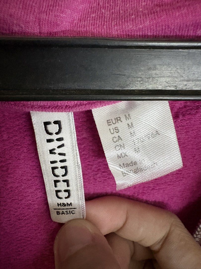 H&M Divided Basic Pink Zip-Up Hoodie (Category: Coats, Jackets and Outerwear) located in Mandaluyong City. Submitted by peachy.cloud (Listing ID 1464210321, Image 2). Description: - H&M Divided Basic pink zip-up hoodie - Size: Medium (M) - Features: Drawstring hood, front pockets - Ideal for: Casual wear You can still see the plastic where the tag was, unused but was left sitting inside the cabinet- has lints that is why selling it for low price.