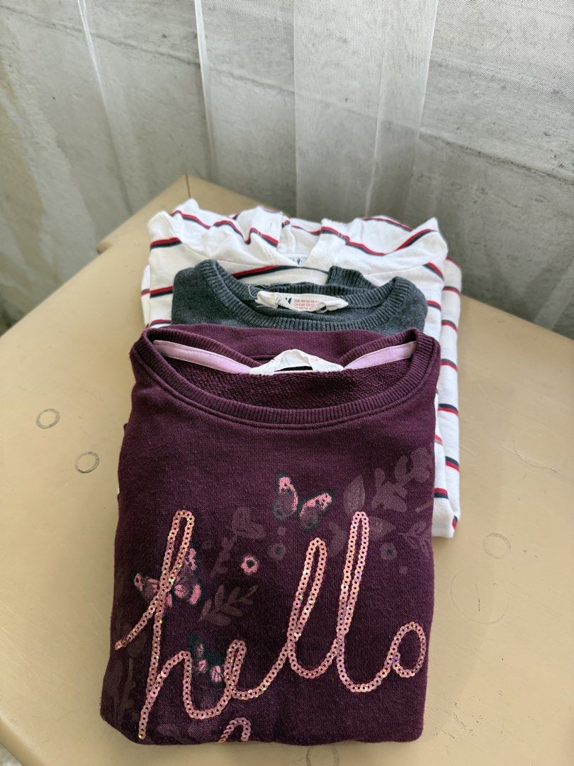H&M Girls' Tops Bundle - Sizes 4-6Y (Category: Babies & Kids Fashion) located in Cabuyao City. Submitted by arral (Listing ID 1464236462, Image 1). Description: - Bundle of 3 H&M girls' tops - Size: 4-6Y - Plum sweatshirt with ' love' sequin detail and butterflies - Grey long-sleeved top with butterfly and 'follow me to the stars' graphic - White long-sleeved top with red and blue stripes.