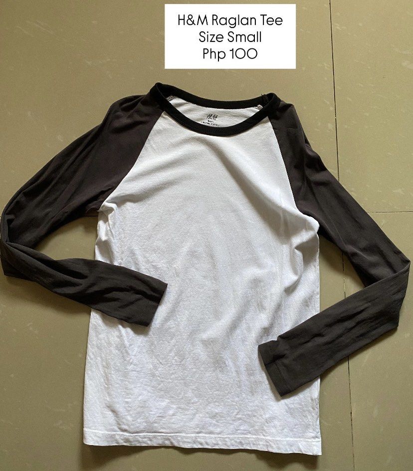H&M Raglan Tee Size Small (Category: Shirts) located in Imus. Submitted by theninetiesboxph (Listing ID 1464261222, Image 1). Description: - Brand: H&M - Style: Raglan T-shirt - Color: White and Dark Grey - Size: Small (S) - Features: Comfortable, classic design - Best for: Casual wear, everyday use.
