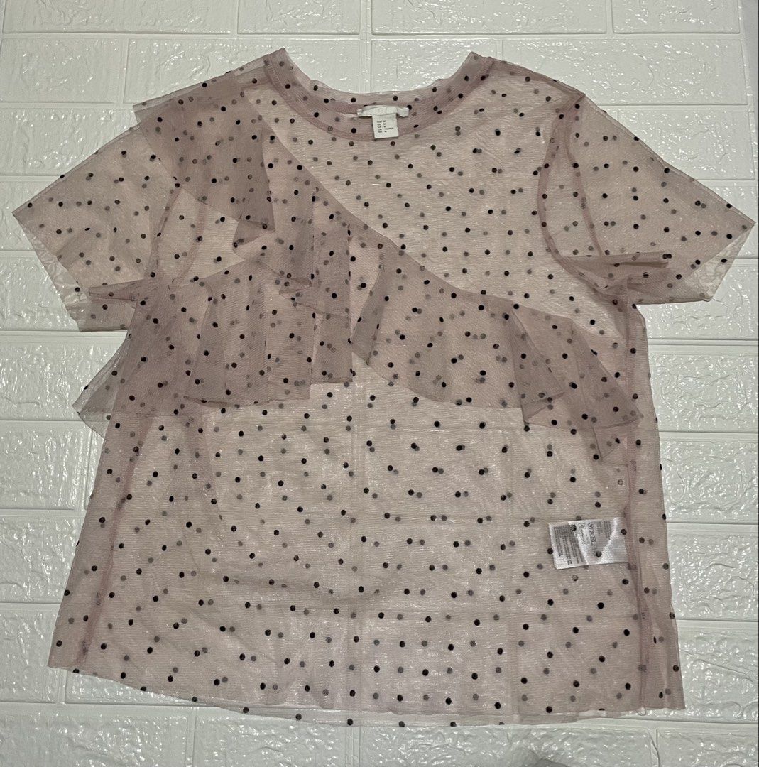 H&M Sheer Mesh Polka Dot Ruffle Top (Category: Shirts) located in Marilao. Submitted by clear_out_closet (Listing ID 1464291315, Image 1). Description: Item Details: 👇 • Brand: H&M • Color: Light Pink with Black Polka Dots • Material: 100% Polyester • Country of Origin: Made in Turkey • Sizing: Tagged Size EUR M / US M / CA M / CN 170/96A / MX M • Condition Note: Excellent pre-loved condition with clean sheer mesh fabric, no visible snags, and i