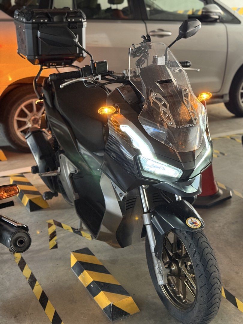 Honda ADV 150 (Category: Motorbikes for Sale) located in Pasig City. Submitted by badmojo999 (Listing ID 1464254552, Image 3). Description: Honda ADV 150 2020 model First owned (complete original papers) New belt, new battery and newly pms 40,+++ km. odo Original Givi bracket included Pasig City meet-ups only Honest issue: front side fairing paint damage only due to accessory adhesive .