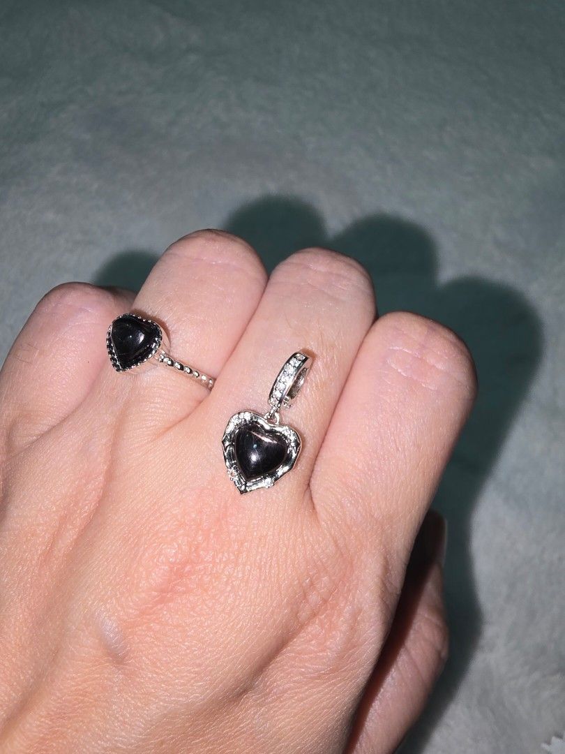 Hyperstene Heart Pendant Necklace and Ring Set (Category: Necklaces) located in Santa Rosa. Submitted by crystal1.0 (Listing ID 1464186525, Image 2). Description: - Adorable heart-shaped pendant necklace and matching ring set. - Both pieces feature a dark, shimmering stone. - Pendant is accented with small clear stones around the edge. - Ring band has intricate detailing. - Adds a touch of sparkle to any outfit. - Selling as a complete set..