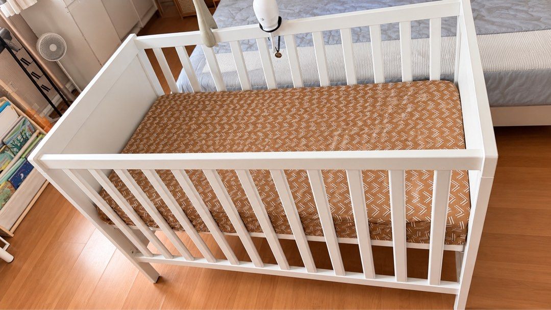 IKEA SUNDVIK Crib White (Category: Cots & Cribs) located in Quezon City. Submitted by nixdeclutters (Listing ID 1464278024, Image 2). Description: - Sturdy white wooden baby crib - Includes mattress base - Easy to assemble - Dimensions: 125cm x 67cm - Fits standard crib mattress - Perfect for your baby's nursery.