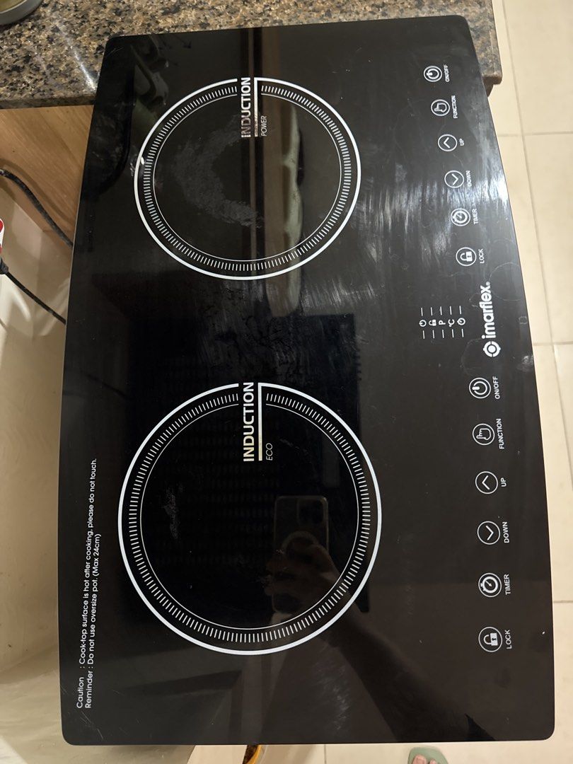 Imarflex Double Induction Cooker (Category: Cookers) located in Mandaluyong City. Submitted by mhaeydeclutters (Listing ID 1464215097, Image 1). Description: - Imarflex Double Induction Cooker - Features Power and Eco modes for efficient cooking - User-friendly control panel with On/Off, Function, Up, Down, Timer, and Lock buttons - Minor surface scratches from normal use - Fully functional and works great!.