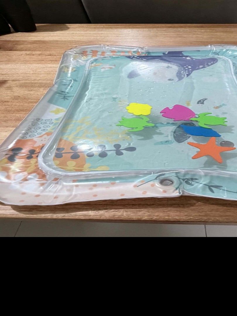 Infantino Tummy Time Water Play Mat (Category: Infant Playtime) located in Taguig. Submitted by bbbautista (Listing ID 1464199421, Image 2). Description: Fun tummy time water mat for babies. Features cute sea creatures like a penguin and a turtle. Includes floating sea toys for little ones to interact with. Helps with sensory development and motor skills. Easy to fill with water and air. Great for keeping baby entertained. Rfs decluterring baby t