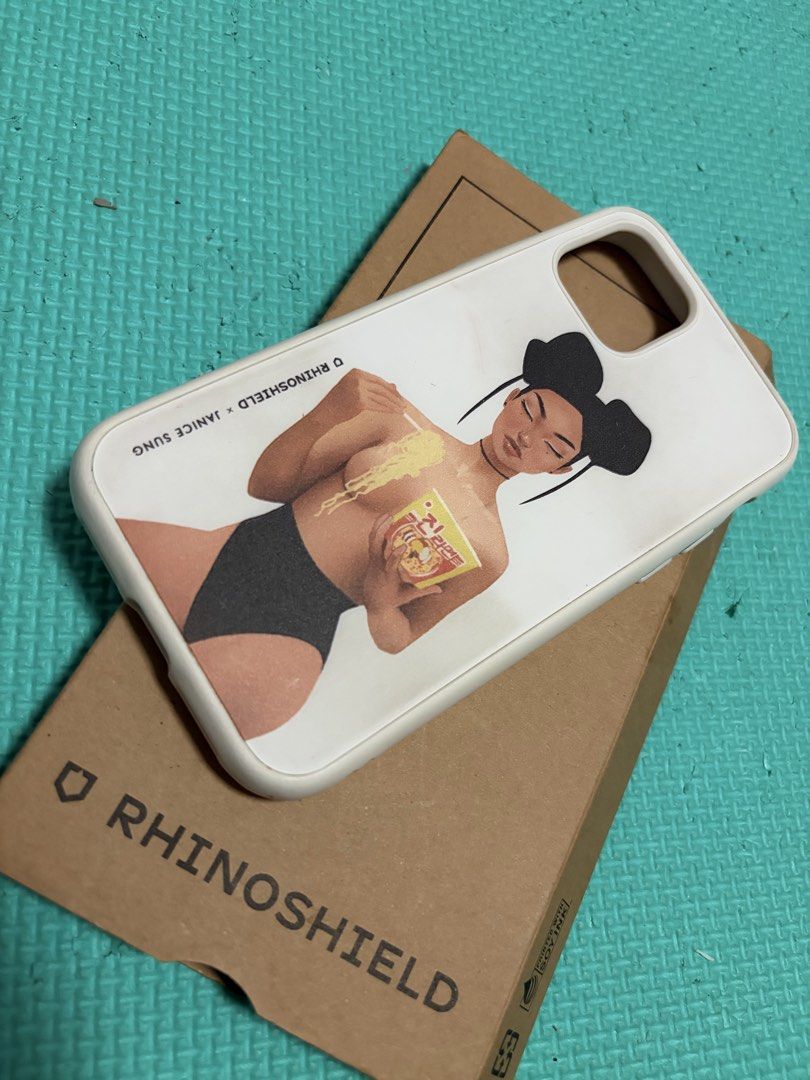 Iphone 11 pro case (Category: Cases & Sleeves) located in Caloocan City. Submitted by kielmarxi38357 (Listing ID 1464245346, Image 1). Description: - Compatible with iPhone 11 Pro - Features a unique artistic design by Janice Sung x Rhinoshield - White case with a striking graphic - Meetup available at SM North EDSA Annex Parking.