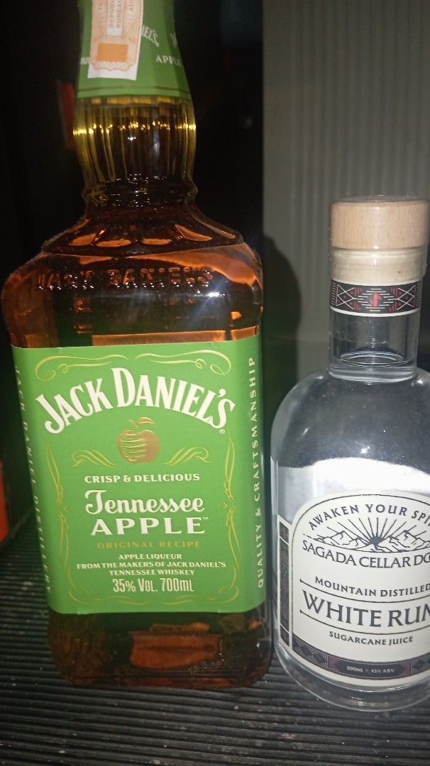Jack Daniel's Tennessee Apple & White Rum Bottles (Category: Beverages) located in Manila. Submitted by zealrabbit_48eb6b (Listing ID 1464264240, Image 1). Description: - Jack Daniel's Tennessee Apple: 700ml bottle, 35% ABV - Sagada Cellar Dog White Rum: 200ml bottle, 45% ABV - Ideal for mixing cocktails or enjoying straight up..