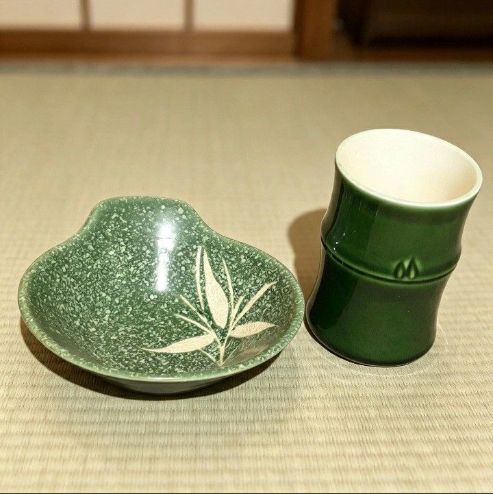 Japanese Bamboo Sake Cup and Dish Set (Category: Coffee & Tea Tableware) located in Iligan City. Submitted by sariranaw (Listing ID 1464245212, Image 2). Description: - Unique green sake cup and matching dish set. - Cup features a distinctive bamboo shape. - Dish has a speckled green finish with an elegant white leaf design. - Ideal for serving sake or as small dipping bowls. - Adds a unique touch to your table setting..