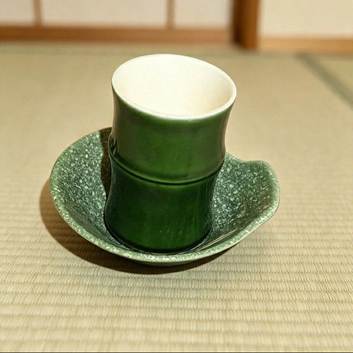 Japanese Bamboo Sake Cup and Dish Set (Category: Coffee & Tea Tableware) located in Iligan City. Submitted by sariranaw (Listing ID 1464245212, Image 3). Description: - Unique green sake cup and matching dish set. - Cup features a distinctive bamboo shape. - Dish has a speckled green finish with an elegant white leaf design. - Ideal for serving sake or as small dipping bowls. - Adds a unique touch to your table setting..