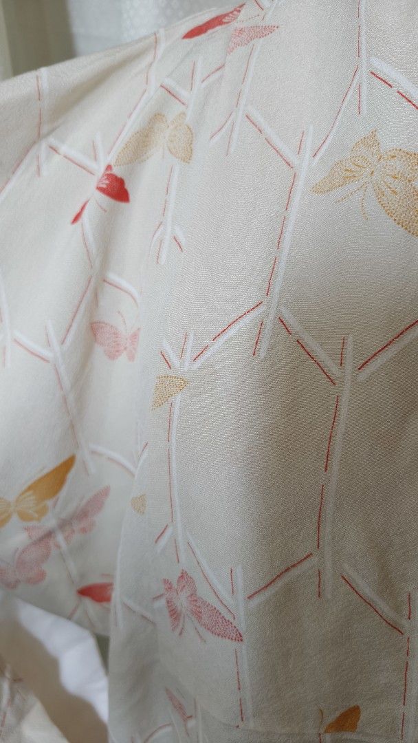 Japanese Kimono with Butterfly Pattern Beige (Category: Coats, Jackets and Outerwear) located in Taguig. Submitted by ymicloset (Listing ID 1464210862, Image 3). Description: - Lightweight kimono Beige color - Beautiful butterfly and bamboo pattern - Cream base with pink, red, and yellow accents - Subtle fabric texture - Wide, flowing sleeves - Perfect for layering or as a statement piece - Approximately 50 inches in length -Shoulder 25 in -Sleev