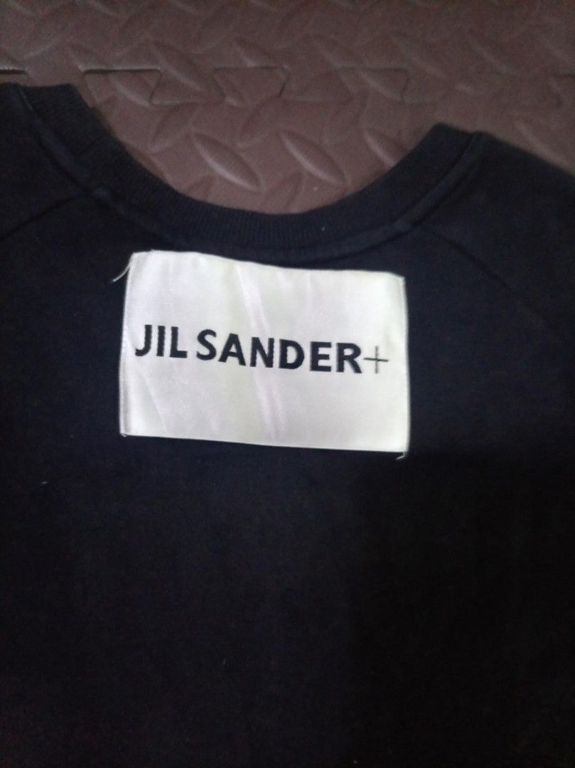 Jil Sander+ Black Logo Sweatshirt (Category: Coats, Jackets and Outerwear) located in San Jose del Monte. Submitted by thegoodthrifts. (Listing ID 1464277944, Image 2). Description: - Black Jil Sander+ sweatshirt - Features Jil Sander logo across the chest - Simple crewneck design - Raglan sleeves for a comfortable fit - Ideal for everyday casual wear - Check the label at the back for details.