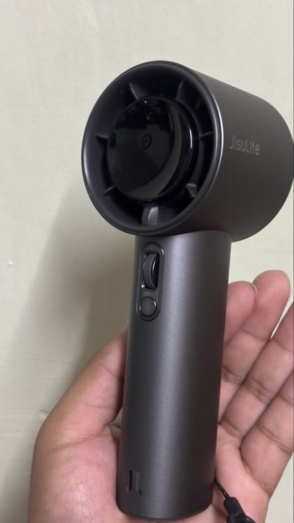 JisuLife Pro1s (2025) (Category: Hair) located in Manila. Submitted by fiercewater-d15e11 (Listing ID 1464252224, Image 3). Description: - Compact and portable JisuLife hair dryer - Convenient USB powered operation - Adjustable speed settings via dial - Includes charging cable and storage pouch - Ideal for travel and quick touch-ups - Sleek dark grey color 2025 version - separate on and off button Larger fan intake 40hours+ battery life Stronger 