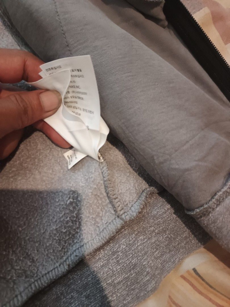 Jordan jacket (Category: Activewear) located in Odiongan. Submitted by thriftngo26 (Listing ID 1464161603, Image 3). Description: This is a grey Jordan full-zip hoodie featuring a distinctive black Jumpman logo near the lower left.