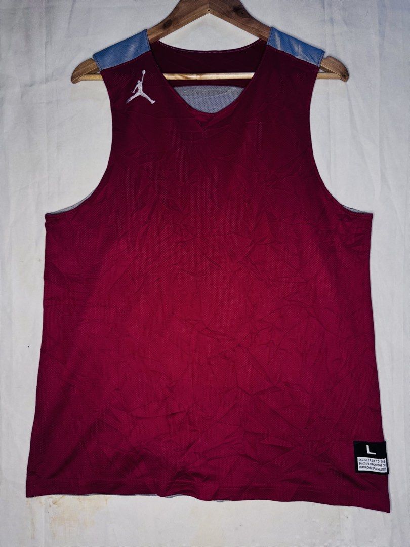 Jordan Reversible Basketball Jersey Size L (Category: Activewear) located in Roxas City. Submitted by patsquarephantz (Listing ID 1464285533, Image 1). Description: - dims W20.5/L28.5 - Reversible Jordan basketball jersey - Size: Large (L) - Side 1: Red with grey neckline and silver Jumpman logo - Side 2: Grey with red neckline and maroon Jumpman logo - "Engineered to the exact specifications of championship athletes." - Ideal for basketball game