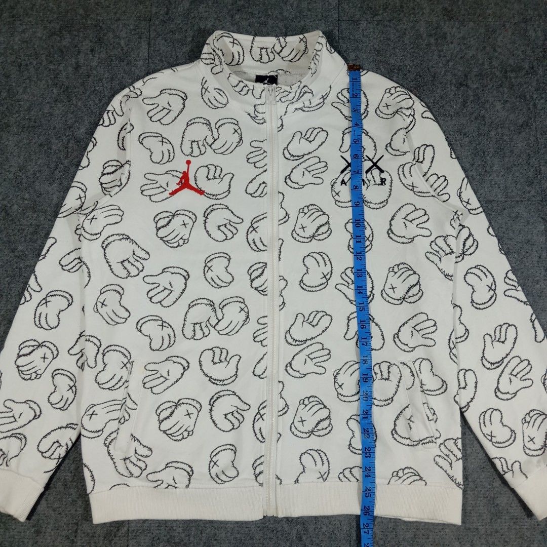 Jordan x Kaws AOP Fullzip Jacket (Category: Coats, Jackets and Outerwear) located in Taguig. Submitted by sito. (Listing ID 1464299229, Image 2). Description: For sale! 📣 Jordan x Kaws AOP Fullzip Jacket Specs and measurements: • Size Medium • Length 26.5 inches • Width 21.5 inches Condition Details: • Issue: Washable Stain • Color rate: 10/10 • Overall Condition: 10/10 Asking Price: ~₱690 (NEGO) Transaction Details: Location: Upper Bicutan, Tag