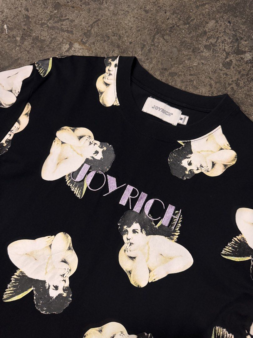 JOYRICH Black Cherub Print T-Shirt (Category: Tshirts & Polo Shirts ) located in Pasig City. Submitted by dripthrift1600 (Listing ID 1464253202, Image 3). Description: - JOYRICH black t-shirt - All-over cherub print - Embroidered JOYRICH logo on front - Comfortable fabric - Perfect statement piece for streetwear - Check tag for size and care - Dimes: 20x27.