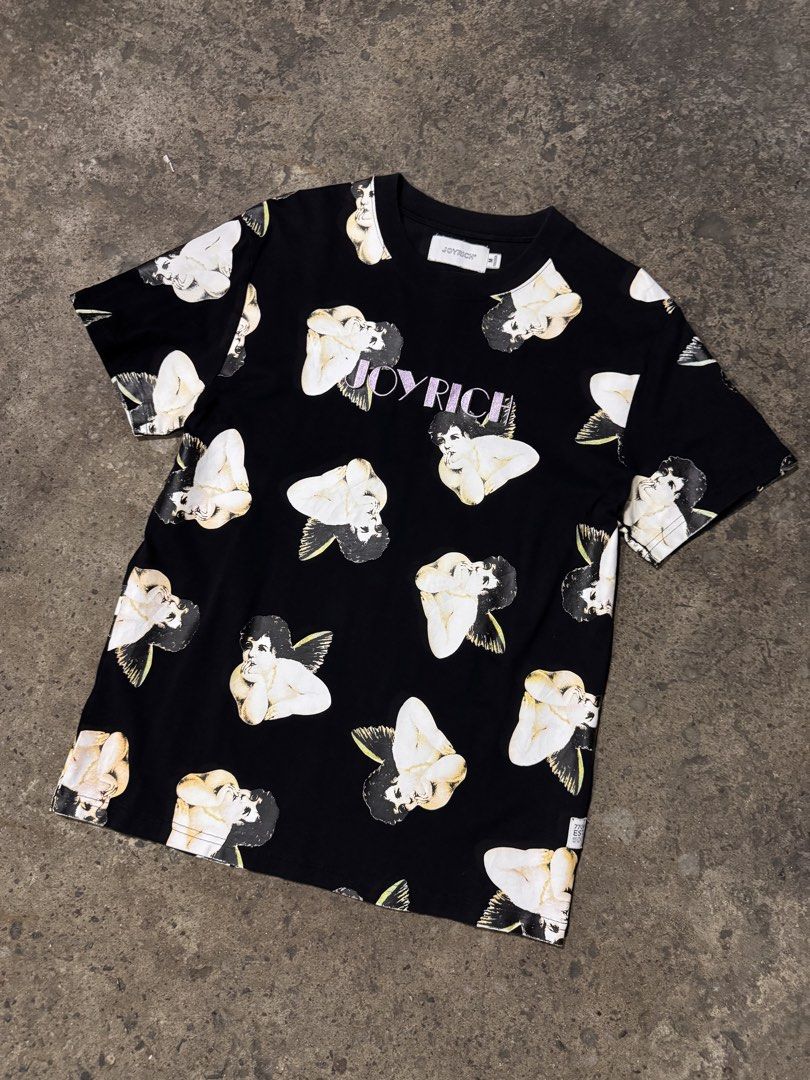 JOYRICH Black Cherub Print T-Shirt (Category: Tshirts & Polo Shirts ) located in Pasig City. Submitted by dripthrift1600 (Listing ID 1464253202, Image 1). Description: - JOYRICH black t-shirt - All-over cherub print - Embroidered JOYRICH logo on front - Comfortable fabric - Perfect statement piece for streetwear - Check tag for size and care - Dimes: 20x27.