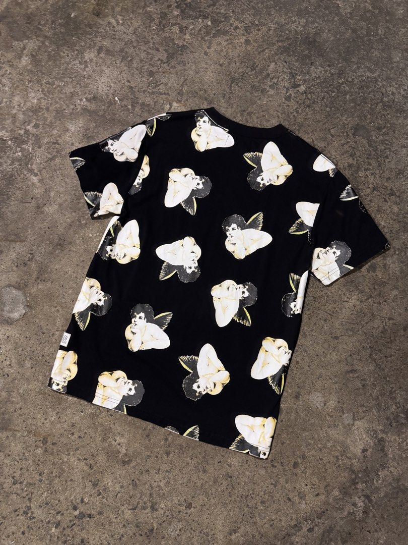 JOYRICH Black Cherub Print T-Shirt (Category: Tshirts & Polo Shirts ) located in Pasig City. Submitted by dripthrift1600 (Listing ID 1464253202, Image 2). Description: - JOYRICH black t-shirt - All-over cherub print - Embroidered JOYRICH logo on front - Comfortable fabric - Perfect statement piece for streetwear - Check tag for size and care - Dimes: 20x27.