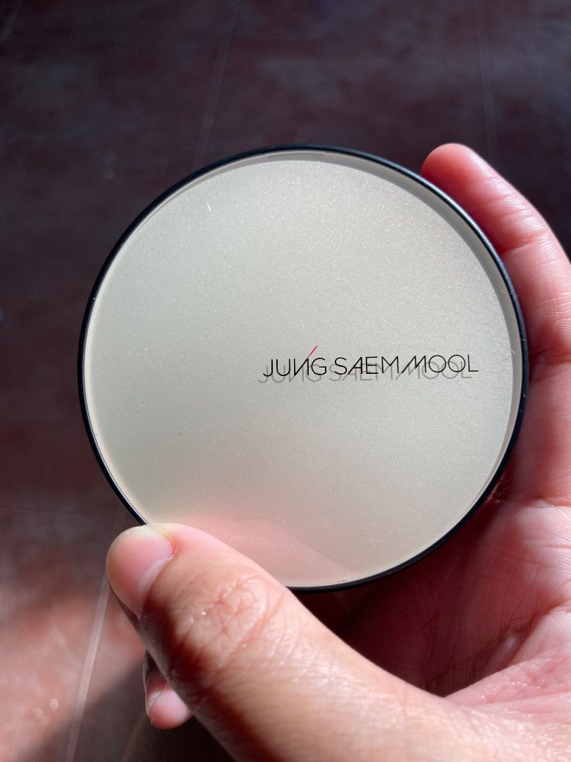 JUNG SAEM MOOL Essential Skin Nuder Cushion Medium (Category: Makeup) located in Manila. Submitted by ehemcoughnut (Listing ID 1464152408, Image 2). Description: - JUNG SAEM MOOL Cushion Compact - Features a lid with a subtle shimmer - Ideal for on-the-go touch-ups - Compact and easy to carry - Used a few times - 900 pesos in orange app RFS: not my shade, bought a new one.