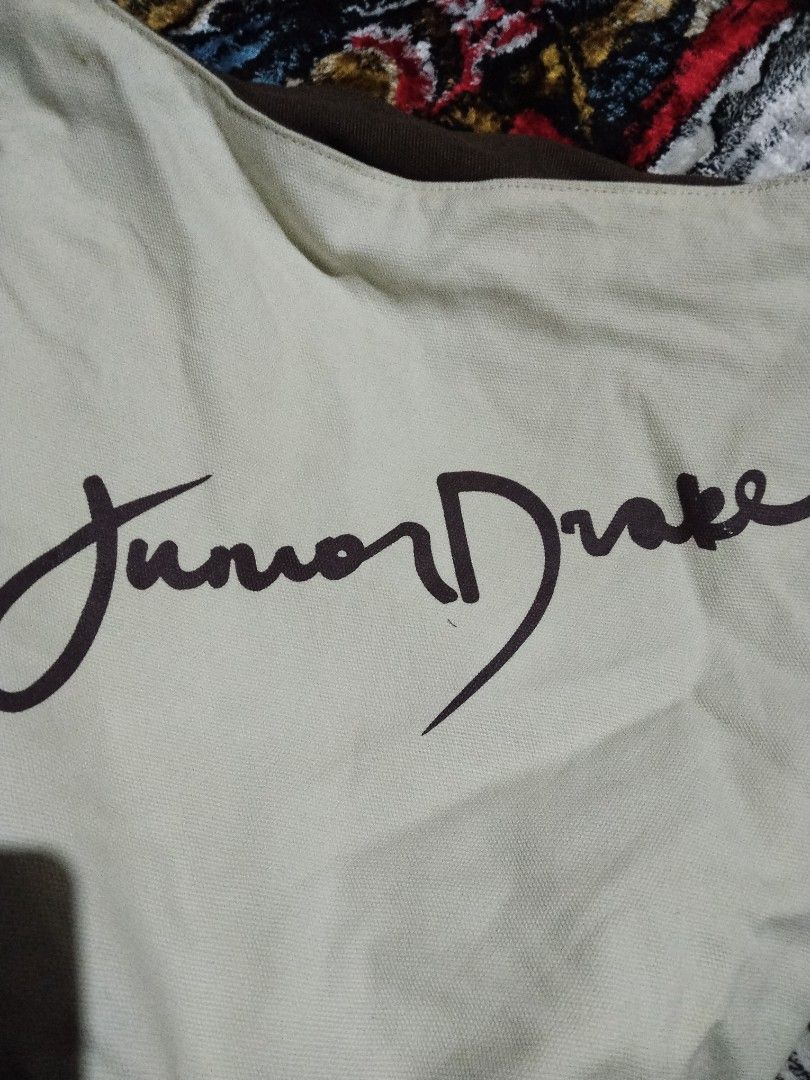 Junior Drake Hobo Bag (Category: Cross-body Bags) located in Mabalacat. Submitted by al_amin_thrift (Listing ID 1464253108, Image 3). Description: Junior Drake Reversible Canvas Hobo Bag Brand: Junior Drake Style: Reversible hobo / shoulder bag — 2 looks in 1! Details: - Side 1: Rich brown canvas with cream "Junior Drake" signature print + cream trim ​ - Side 2: Soft cream canvas with brown signature print + brown trim ​ - Spacious, slouchy shape