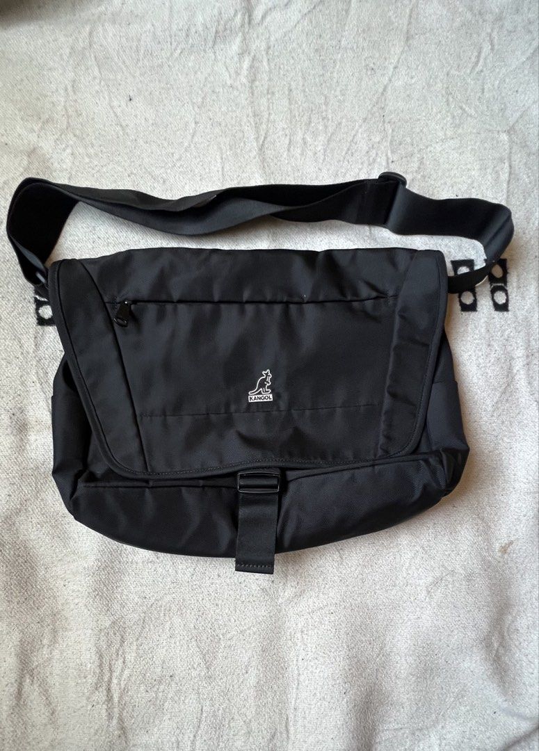 Kangol Black Messenger Bag (Category: Sling Bags) located in Cagayan de Oro. Submitted by nelsondel21723 (Listing ID 1464184347, Image 1). Description: - Black Kangol messenger bag - Main zip compartment - Front flap with buckle closure - Multiple internal pockets for organization - Adjustable shoulder strap - Ideal for daily use or travel - Clean and functional design.