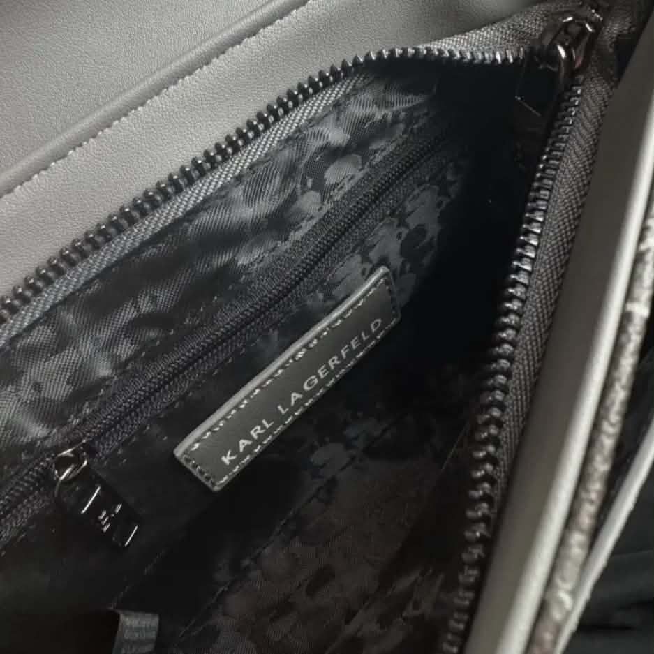 Karl Lagerfeld Monogram Crossbody Bag (Category: Cross-body Bags) located in Cavite. Submitted by mahthriftshop (Listing ID 1464265249, Image 3). Description: -Singapore mop gcash+sf - Karl Lagerfeld crossbody bag - Features all-over KL monogram pattern - Secure buckle closure on front flap - Adjustable strap with Karl Lagerfeld branding - Interior zip pocket for essentials - Ideal for everyday use.