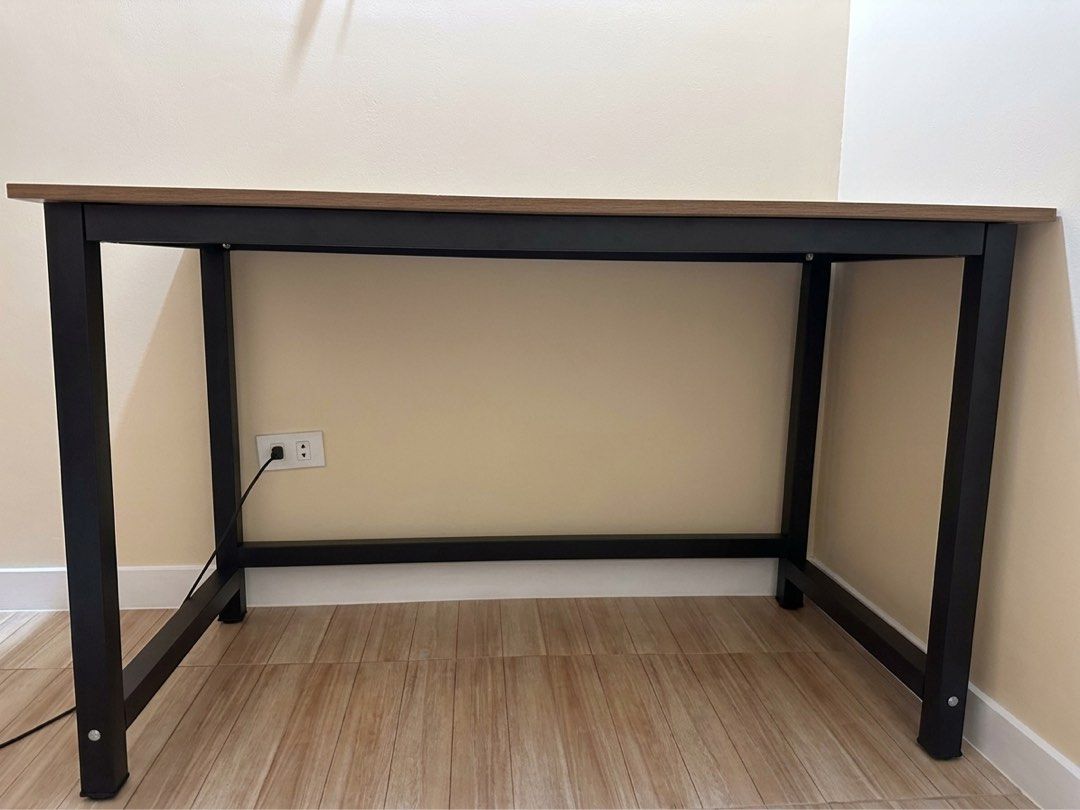 karry home brown wood computer table desk (120cm width) (Category: Tables & Sets) located in Binan City. Submitted by nakednini (Listing ID 1464166260, Image 2). Description: ⋆ got this last 9/22/26 only! ⋆ dimensions: 120*60*75cm ⋆ wood board + stainless steel ⋆ 1.6cm thick board ⋆ stable, non shaking ⋆ item is already set up so there's no box anymore ⋆ pickup preferred! dm me if you'd like more details 💌.