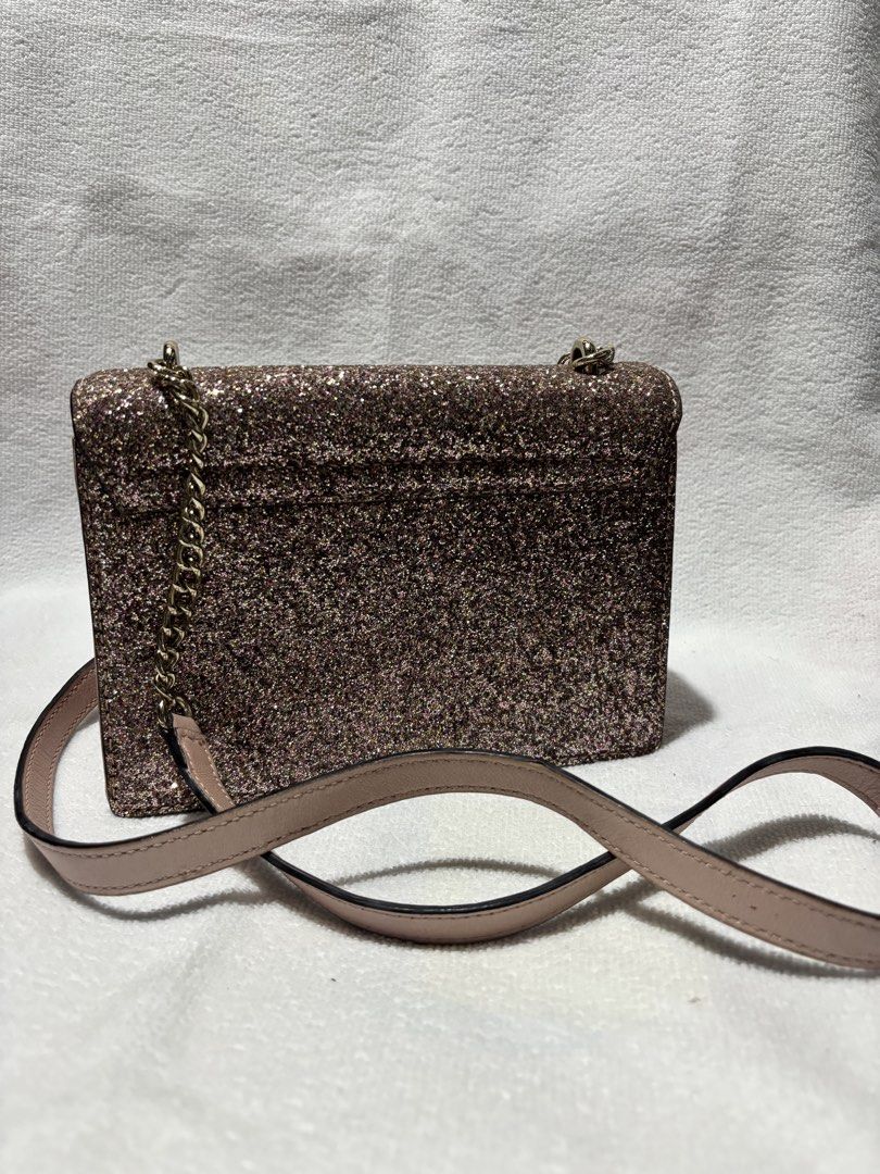 Kate Spade Glitter Crossbody Bag (Category: Cross-body Bags) located in Quezon City. Submitted by prelovedby.cxx (Listing ID 1464296093, Image 2). Description: Kate Spade Sunset Lane Pink Glitter Bag with chain crossbody strap Used 4 times max, good condition 100% auth bought in US Ideal for evening events or adding sparkle to any outfit Price is nego. Rfs. Decluttering. Need to declutter before buying a new bag Handbag, slingbag, party.