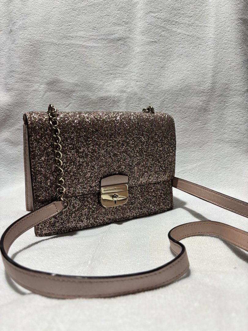 Kate Spade Glitter Crossbody Bag (Category: Cross-body Bags) located in Quezon City. Submitted by prelovedby.cxx (Listing ID 1464296093, Image 1). Description: Kate Spade Sunset Lane Pink Glitter Bag with chain crossbody strap Used 4 times max, good condition 100% auth bought in US Ideal for evening events or adding sparkle to any outfit Price is nego. Rfs. Decluttering. Need to declutter before buying a new bag Handbag, slingbag, party.