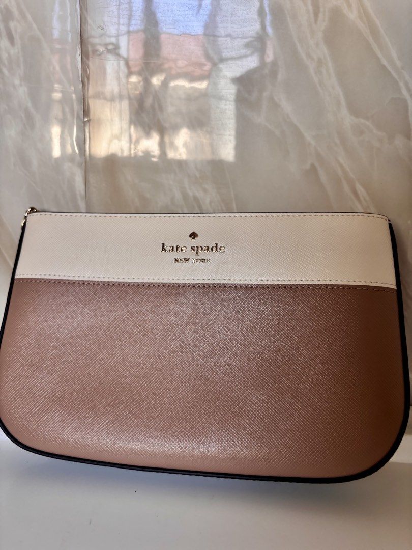Kate Spade Madison Lilly Pochette (Category: Cross-body Bags) located in Caloocan City. Submitted by lovelj_2026 (Listing ID 1464250651, Image 3). Description: Brand new Never been used 🧡🧡 With tag price and silica gel - Authentic Kate Spade New York clutch - Stylish colorblock design in beige and cream - Elegant gold chain strap - Convenient interior card slots - Ideal for evening wear or as a statement accessory.