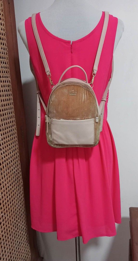 Kate Spade New York Velvet Mini Backpack (Category: Backpacks) located in Siniloan. Submitted by treyyasonlineshop (Listing ID 1464259327, Image 1). Description: - Cute mini backpack from Kate Spade - Tan velvet and light pink leather combination - Features a front pocket - Adjustable straps for comfort - Minor wear on leather pocket and small scuff on the side - Plenty of life left, great for everyday use Mini size Backpack/sling bag Leather/vel
