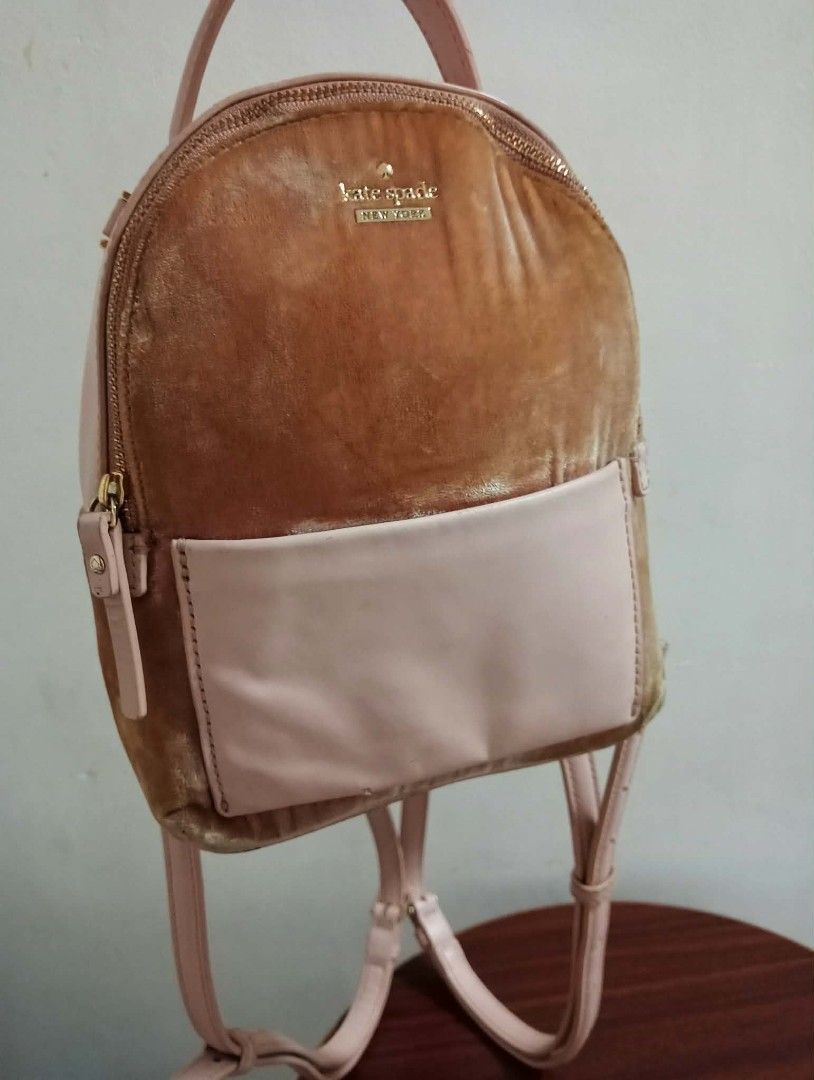 Kate Spade New York Velvet Mini Backpack (Category: Backpacks) located in Siniloan. Submitted by treyyasonlineshop (Listing ID 1464259327, Image 3). Description: - Cute mini backpack from Kate Spade - Tan velvet and light pink leather combination - Features a front pocket - Adjustable straps for comfort - Minor wear on leather pocket and small scuff on the side - Plenty of life left, great for everyday use Mini size Backpack/sling bag Leather/vel
