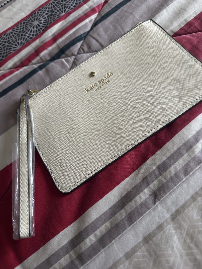 Kate Spade Slim Pouch/Wallet (Category: Clutches) located in Davao. Submitted by sayvc (Listing ID 1464143632, Image 1). Description: Brand new Decluttering Add 90 pesos for shipping Can be used as a wallet.