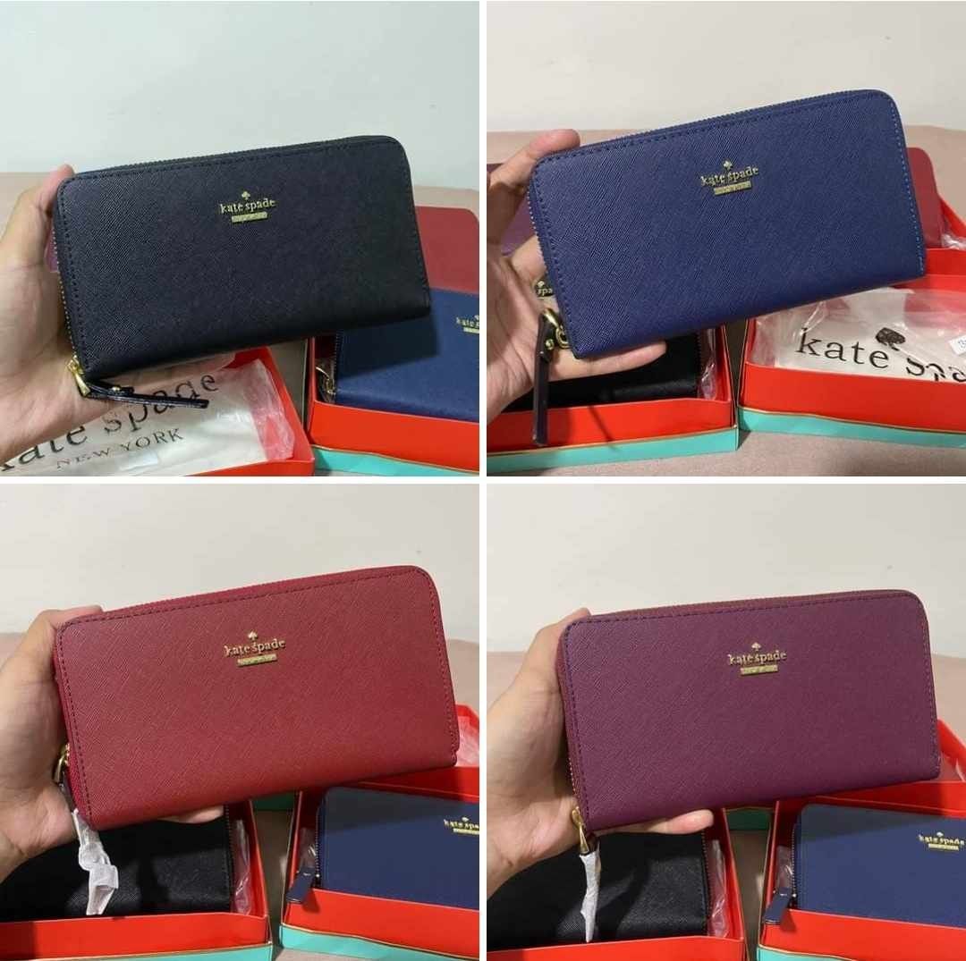 Kate Spade Zip Around Wallet - Multiple Colors Available (Category: Wallets & Card holders) located in Bacoor. Submitted by berezia_olshoppe (Listing ID 1464177452, Image 1). Description: - K@te Spa♤de Zip Around Wallets - Available Colors: Navy, Black, Red, Burgundy - Includes Box (slightly dented) - Classic, Everyday Design - Ideal for Gifting - Features Multiple Card Slots - Includes Interior Zip Pocket.