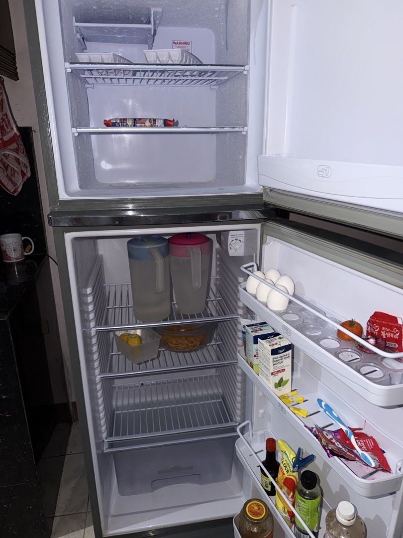 Kelvinator 2-Door Refrigerator Non-Inverter (Category: Refrigerators and Freezers) located in San Pedro. Submitted by Ferdie (Listing ID 1464138049, Image 2). Description: - Kelvinator 2-door refrigerator - Top freezer compartment - Ample shelf space inside - Height: 1.53 meters - Excellent for food preservation - Fully functional - Minor cosmetic scuffs on exterior.