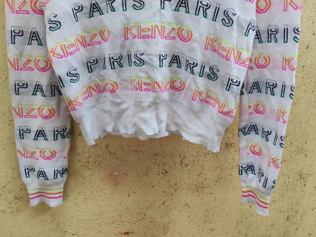 Kenzo Paris White Knit Sweater (Category: Longsleeves) located in City of Isabela. Submitted by jasheverything (Listing ID 1464141982, Image 3). Description: - Kenzo Paris knit sweater - Color: White with all-over colorful print - Size: Medium (M) - Features: Crew neck, long sleeves, colorful cuff accents - Material: Lightweight knit - Condition: Great piece for your wardrobe Excellent Condition 1350+SF.