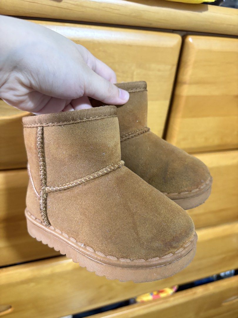 Kids Brown Suede Boots (Category: Babies & Kids Fashion) located in Subic. Submitted by ysbllrs (Listing ID 1464286477, Image 1). Description: - Adorable brown boots for kids - Made with soft suede material - Features charming decorative stitching - Easy slip-on design for quick wear - Durable soles with excellent grip - Keeps little feet warm and cozy.