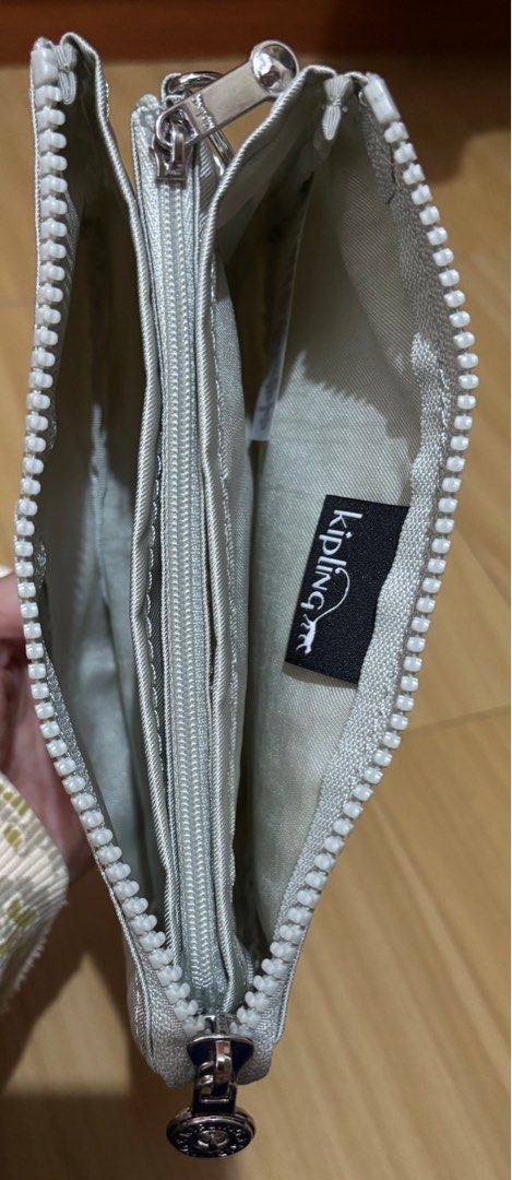 Kipling Pouch / Wristlet / Wallet Metallic Silver (Category: Purses & Pouches) located in Quezon City. Submitted by beckyshop2024 (Listing ID 1464343830, Image 3). Description: - Brand new - Original from US - With 5 inside partitions, 1 with zip.