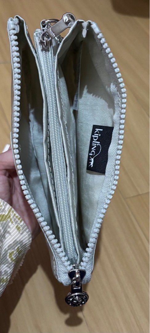 Kipling Pouch / Wristlet / Wallet Metallic Silver (Category: Purses & Pouches) located in Quezon City. Submitted by beckyshop2024 (Listing ID 1464343830, Image 2). Description: - Brand new - Original from US - With 5 inside partitions, 1 with zip.