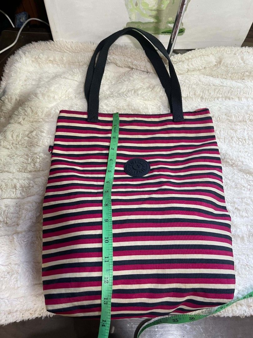 Kipling stripe tote bag Original (Category: Tote Bags) located in Naawan. Submitted by twillycalledprelovedbags (Listing ID 1464172554, Image 3). Description: missing monkey.