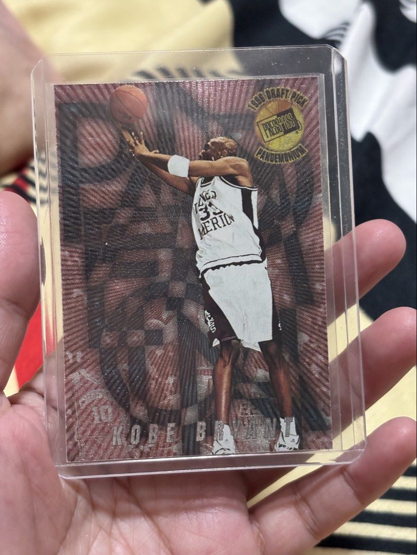 Kobe Bryant (Category: Raw Singles) located in Rizal. Submitted by mzreas (Listing ID 1464164554, Image 1). Description: 🔥 Kobe Bryant early-career/rookie-year collectible 🔥 1996 Press Pass Pandemonium 🔥 Card #PM3 – 3 of 12 🔥 Lower Merion High School 🔥 Original vintage card 🔥 Comes in protective hard case as shown ✅Condition: Please see photos for actual condition. Raw/ungraded card. #KobeBryant #KobeBryantCard #KobeCard #KobeRookie #KobeRo
